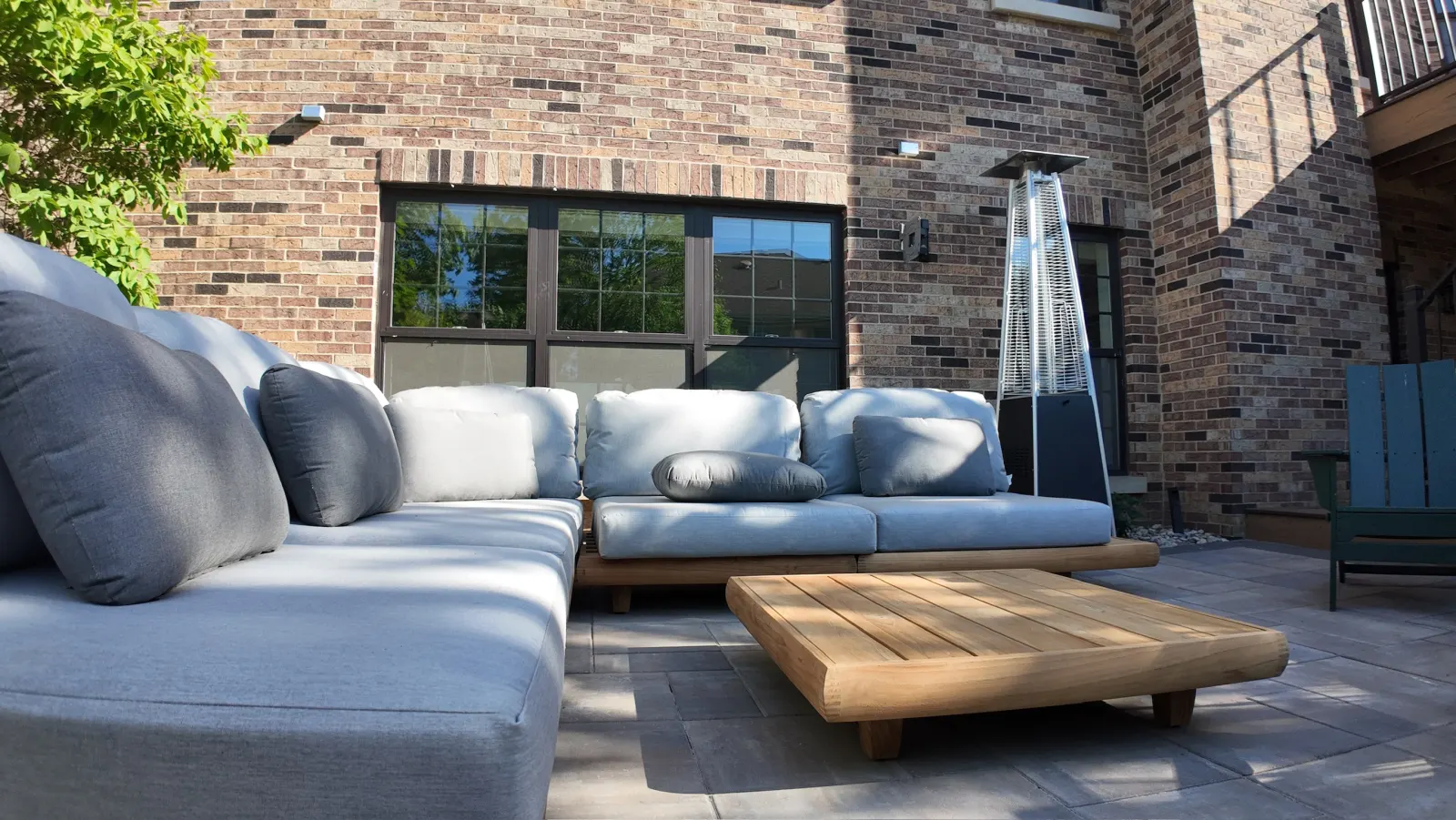 Luxury outdoor living paver patio with teak sectional seating — Naperville, IL